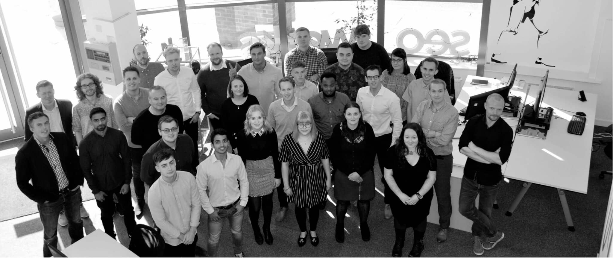 seo works team picture in office building
